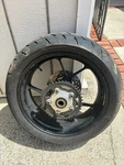 Aprilia RSV1000R Factory Rear Wheel, Brake Rotor, Sprocket, Tire (complete). Fixed Price $299.00.