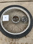 1975 Honda TL250 Front Wheel, W/ Brake Plate And Axle. Fixed Price $80.00.